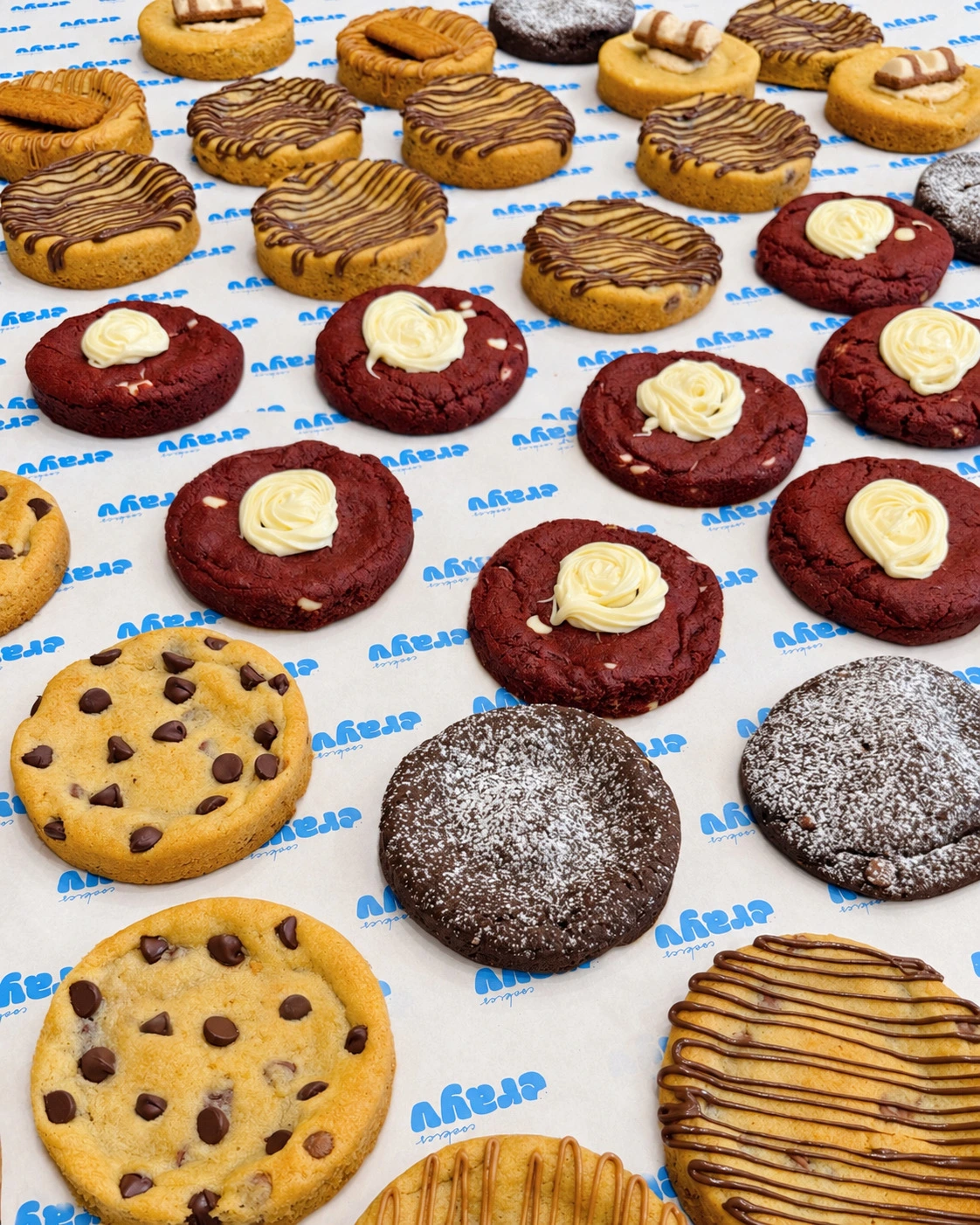 An assortment of CRAYV cookies on branded paper