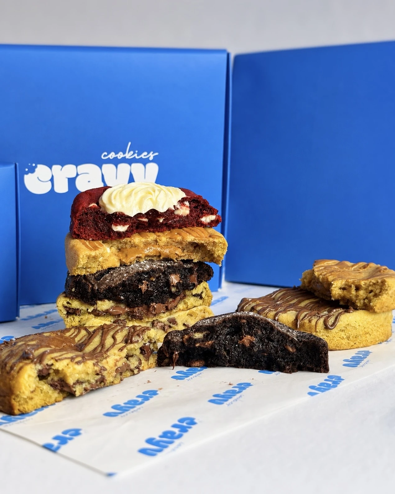 Filled CRAYV cookies with blue branded boxes